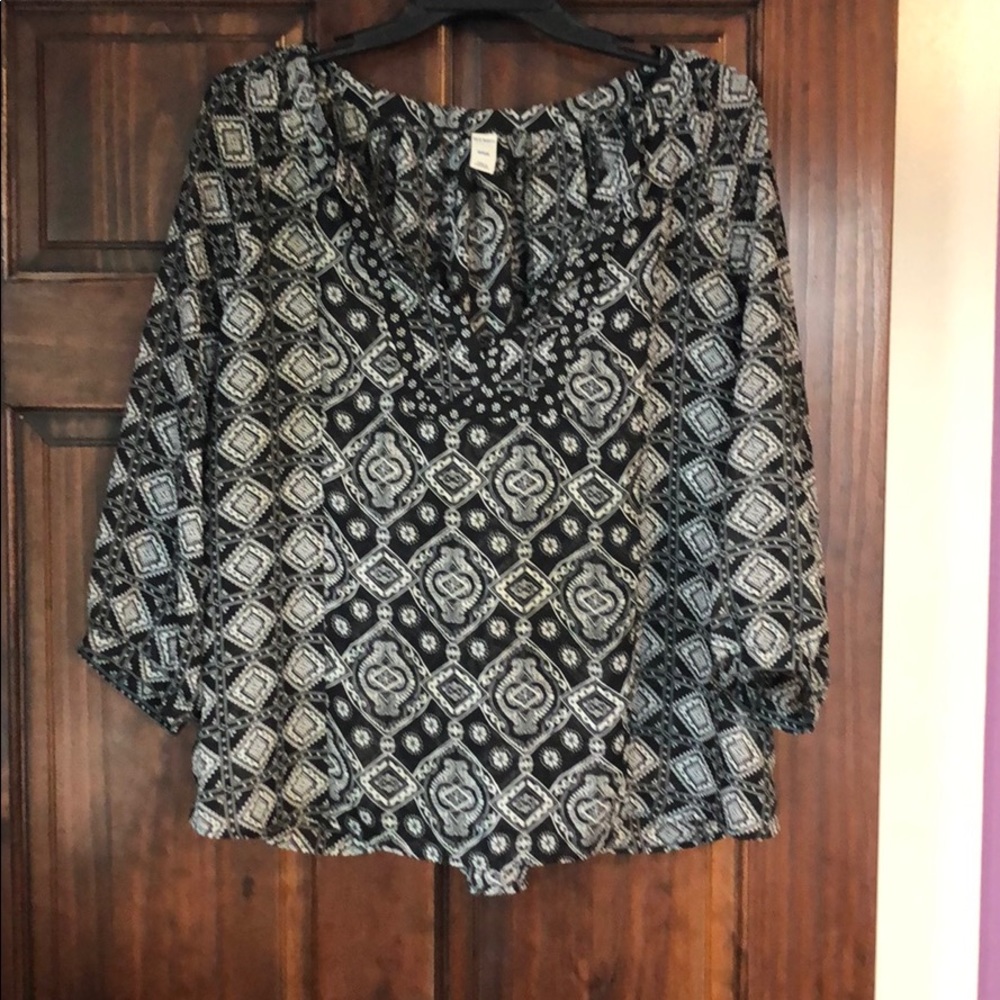 Gray and black V neck blouse.